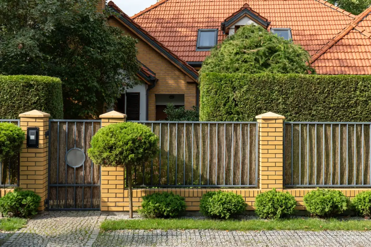 fence in front of house made by a residential fence company near me